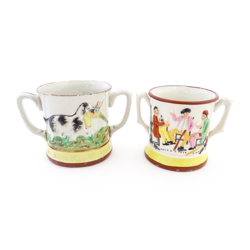 59A - Two Staffordshire pottery loving cups / frog mugs, one with relief decoration depicting a hunting do... 