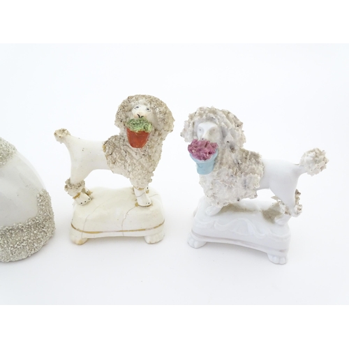 60 - A quantity of assorted Victorian and later Staffordshire style poodle dogs. Largest approx. 4 1/2