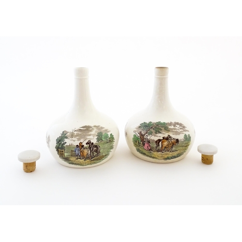 66 - A pair of Copeland Spode lidded bottle vases / flagons decorated with country scenes. Marked under. ... 