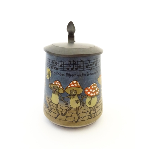 73 - A German half litre stein decorated with dancing mushroom / toadstool figures with music score above... 