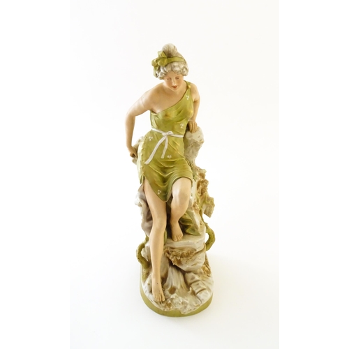 74 - A Royal Dux model of a maiden seated on a rocky outcrop, model number 206. Marked under. Approx. 15 ... 