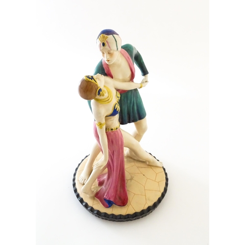 75 - A Royal Dux Art Deco figural group of two dancers, possibly modelled as Rudolph Valentio and Vilma B... 