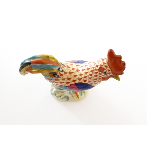 79 - A Herend porcelain model of a cockerel / rooster with fishnet decoration and gilt highlights. Marked... 