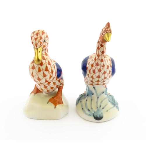 81 - Two Herend porcelain models of birds comprising guinea fowl, and duck, both with fishnet decoration ... 