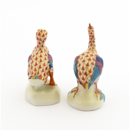 81 - Two Herend porcelain models of birds comprising guinea fowl, and duck, both with fishnet decoration ... 