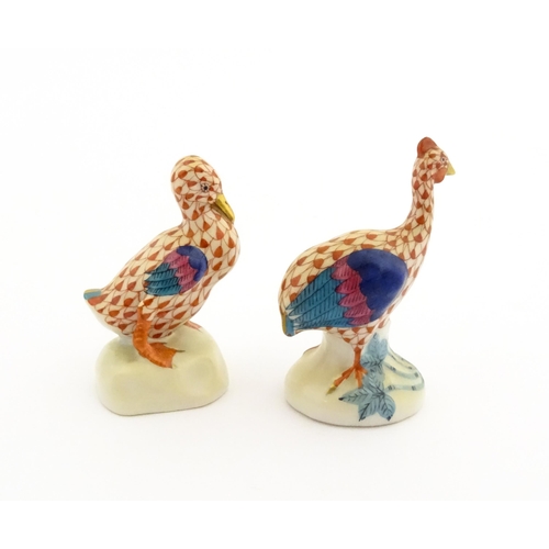 81 - Two Herend porcelain models of birds comprising guinea fowl, and duck, both with fishnet decoration ... 