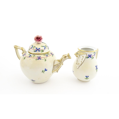 83 - A Herend porcelain teapot decorated in the Cornflower pattern with floral decoration and gilt highli... 