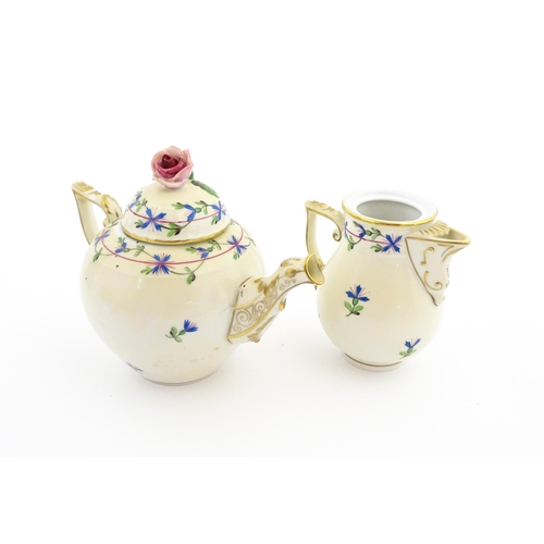 83 - A Herend porcelain teapot decorated in the Cornflower pattern with floral decoration and gilt highli... 