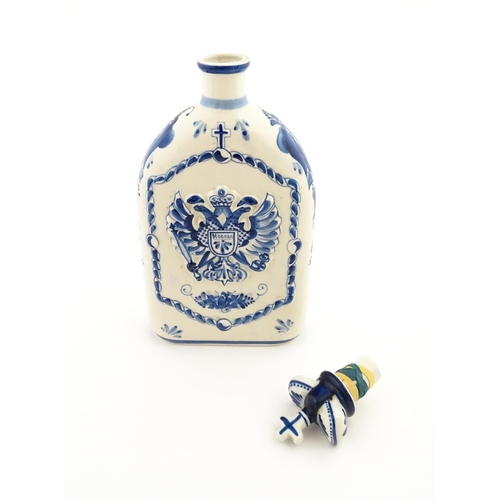 86 - A Russian Shekma Gzhel blue and white ceramic bottle and stopper / decanter decorated with castle to... 