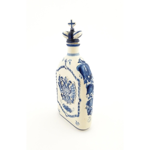 86 - A Russian Shekma Gzhel blue and white ceramic bottle and stopper / decanter decorated with castle to... 