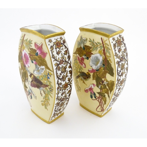 89 - A pair of Limoges Demartial and Tallandier vases of ovoid form decorated with exotic birds, flowers ... 