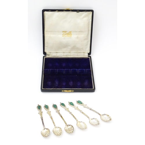 661 - A set of six silver plate teaspoons with green jade coloured cabochon detail to handles. Cased. Appr... 