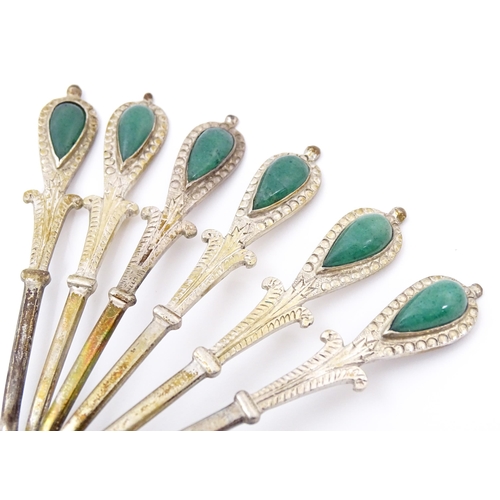 661 - A set of six silver plate teaspoons with green jade coloured cabochon detail to handles. Cased. Appr... 