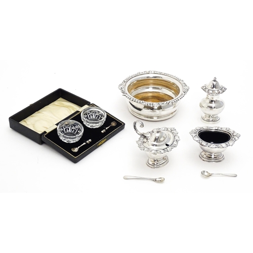 671 - A quantity of silver plate items to include coaster with turned wooden base, cruet set, etc.