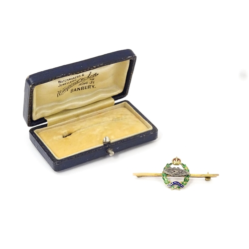 833 - Military Interest : A 9ct gold regimental bar brooch for the Royal Tank Corps depicting insignia wit... 