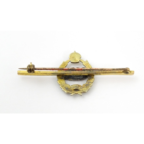 833 - Military Interest : A 9ct gold regimental bar brooch for the Royal Tank Corps depicting insignia wit... 