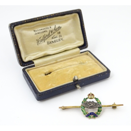 833 - Military Interest : A 9ct gold regimental bar brooch for the Royal Tank Corps depicting insignia wit... 