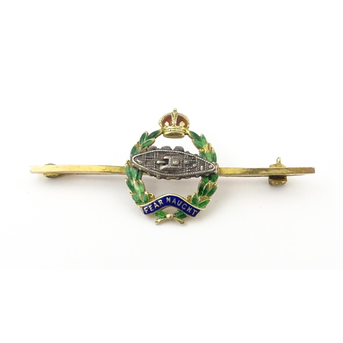 833 - Military Interest : A 9ct gold regimental bar brooch for the Royal Tank Corps depicting insignia wit... 