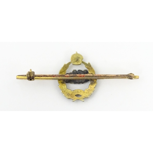 833 - Military Interest : A 9ct gold regimental bar brooch for the Royal Tank Corps depicting insignia wit... 