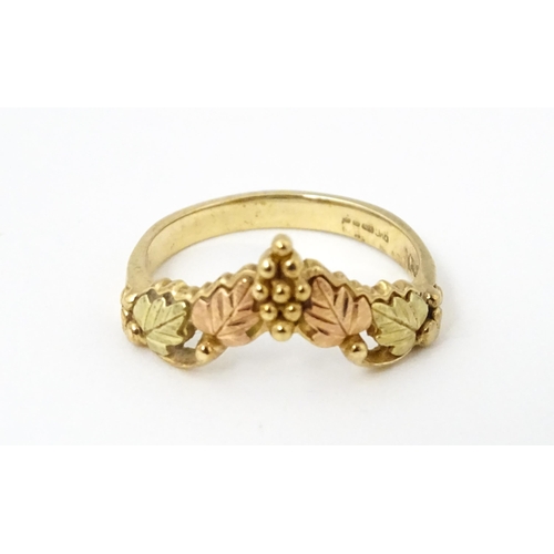 861 - A 9ct gold ring with rose gold detail. Ring size approx. L. Together with a matching pair of drop ea... 