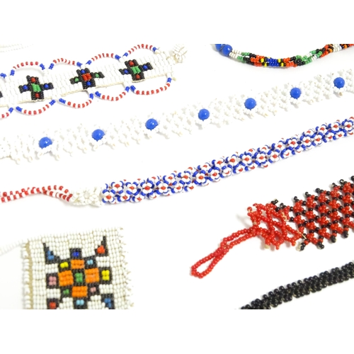 891A - A quantity of assorted beadwork jewellery to include necklaces, bracelets, etc. Some African example... 