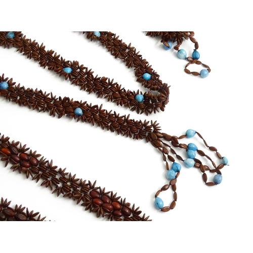 892 - A quantity of assorted seed bead necklaces to include examples from St Helena