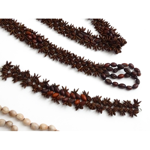 892 - A quantity of assorted seed bead necklaces to include examples from St Helena