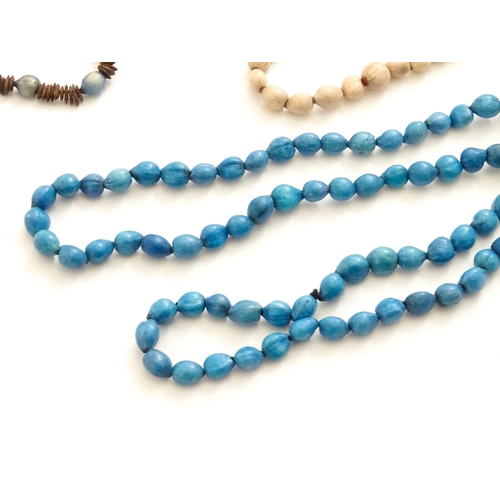 892 - A quantity of assorted seed bead necklaces to include examples from St Helena