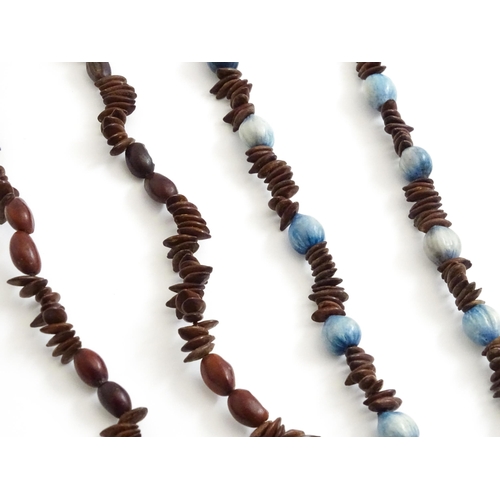 892 - A quantity of assorted seed bead necklaces to include examples from St Helena