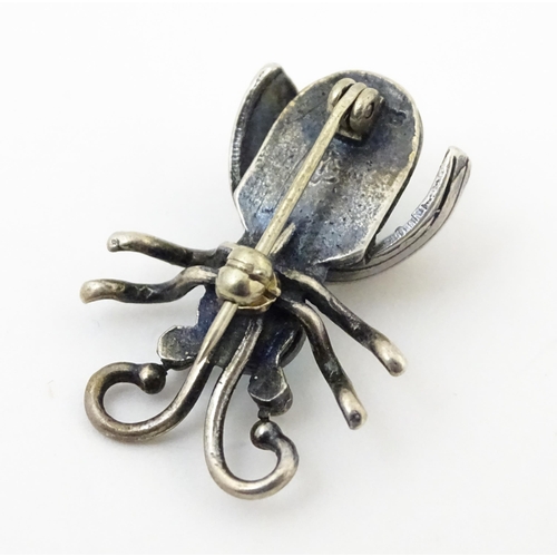 908 - Three assorted brooches / pins to include a silver example formed as a insect / bug set with turquoi... 