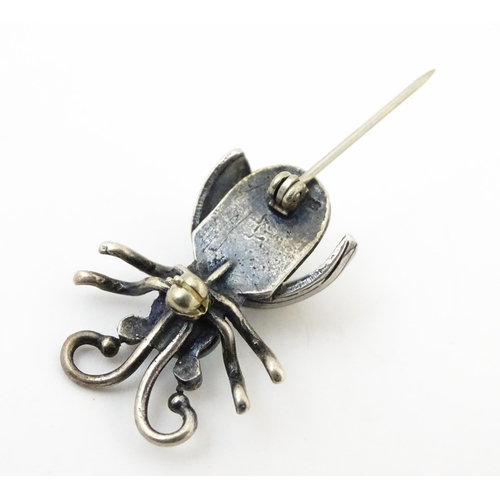 908 - Three assorted brooches / pins to include a silver example formed as a insect / bug set with turquoi... 