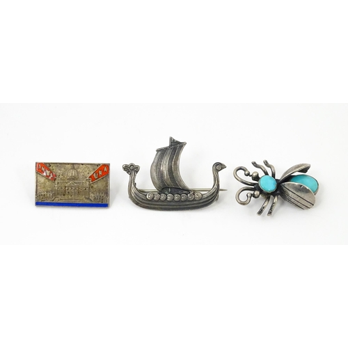 908 - Three assorted brooches / pins to include a silver example formed as a insect / bug set with turquoi... 