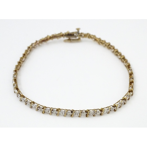 879 - A 9ct gold bracelet set with diamonds. Approx. 7 1/2