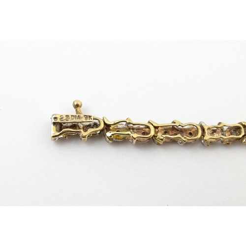 879 - A 9ct gold bracelet set with diamonds. Approx. 7 1/2