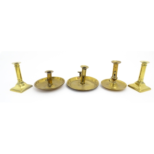 1086 - Five assorted 19thC and later brass candlesticks to include chambersticks, some ejector examples. La... 