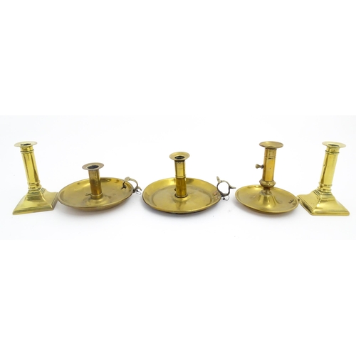 1086 - Five assorted 19thC and later brass candlesticks to include chambersticks, some ejector examples. La... 