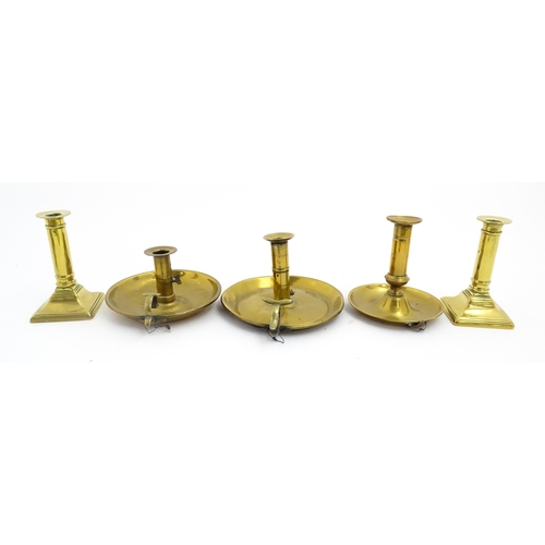 1086 - Five assorted 19thC and later brass candlesticks to include chambersticks, some ejector examples. La... 