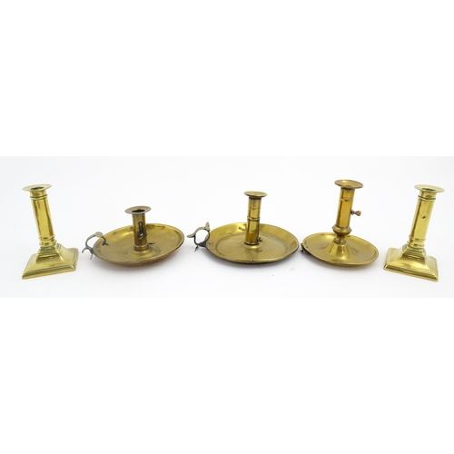 1086 - Five assorted 19thC and later brass candlesticks to include chambersticks, some ejector examples. La... 