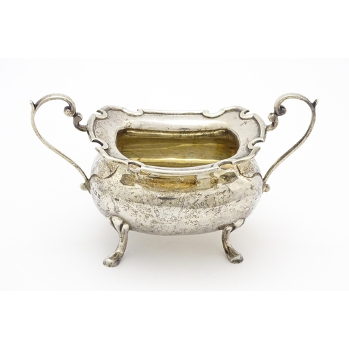 277 - A silver sugar bowl with twin handles, hallmarked Birmingham, 1912 maker E S Barnsley & Co (Edward S... 