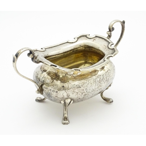 277 - A silver sugar bowl with twin handles, hallmarked Birmingham, 1912 maker E S Barnsley & Co (Edward S... 