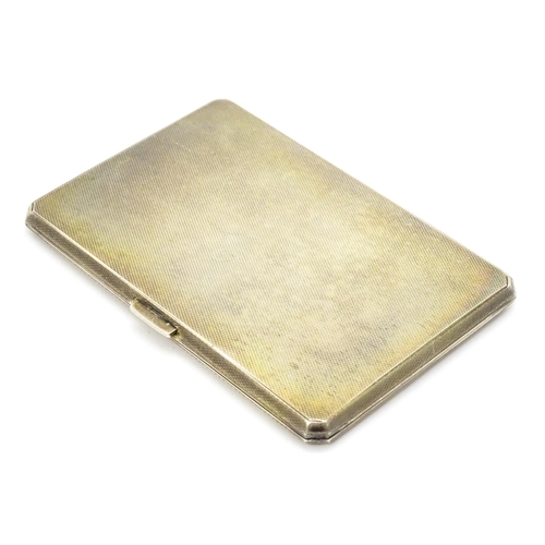 288 - A silver cigarette case with engine turned decoration, hallmarked Birmingham 1962, maker S. J. Rose ... 