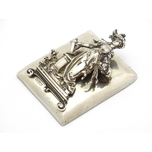 289 - A silver desk / paper clip depicting the personification of Plenty, hallmarked Chester 1901, maker G... 