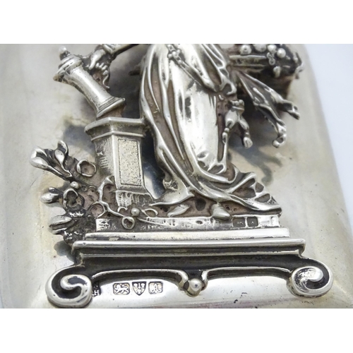 289 - A silver desk / paper clip depicting the personification of Plenty, hallmarked Chester 1901, maker G... 