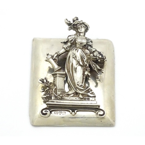 289 - A silver desk / paper clip depicting the personification of Plenty, hallmarked Chester 1901, maker G... 