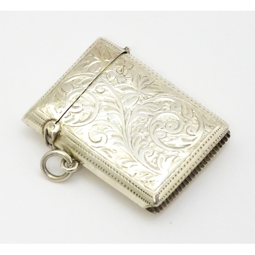 290 - A silver vesta case with engraved acanthus scroll decoration hallmarked Birmingham 1910, maker Josep... 