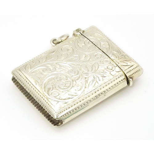 290 - A silver vesta case with engraved acanthus scroll decoration hallmarked Birmingham 1910, maker Josep... 