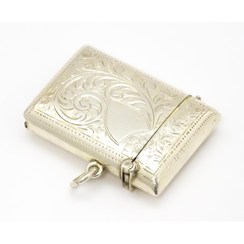 290 - A silver vesta case with engraved acanthus scroll decoration hallmarked Birmingham 1910, maker Josep... 