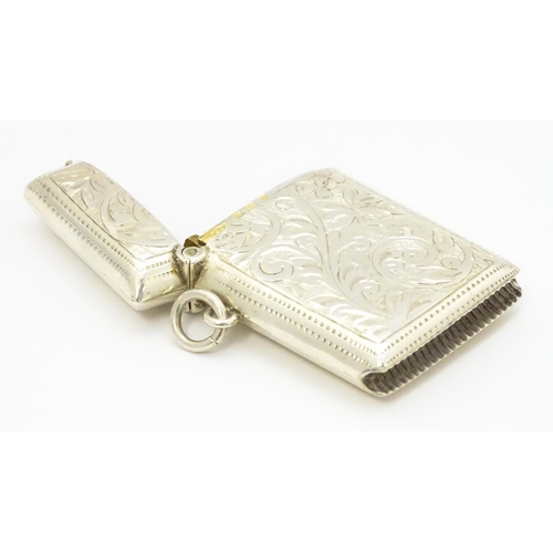 290 - A silver vesta case with engraved acanthus scroll decoration hallmarked Birmingham 1910, maker Josep... 