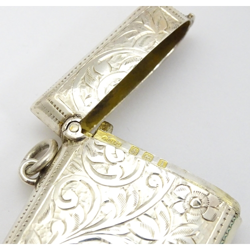 290 - A silver vesta case with engraved acanthus scroll decoration hallmarked Birmingham 1910, maker Josep... 