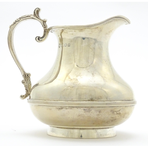 294 - A silver jug hallmarked London 1934, maker Goldsmiths & Silversmiths Co. Ltd. Approx. 4 1/2